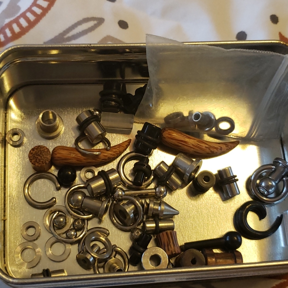 Tin full of Gauged Ear Plugs